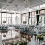 gray chairs, white table, chandeliers and flowers
