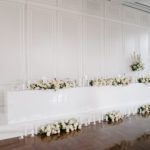 white wall and flowers