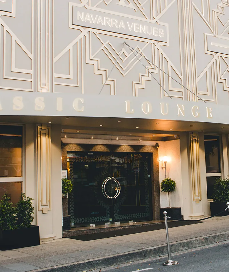View of Conca D’oro’s entrance, with a cream Art Deco façade and Navarra Venues signage