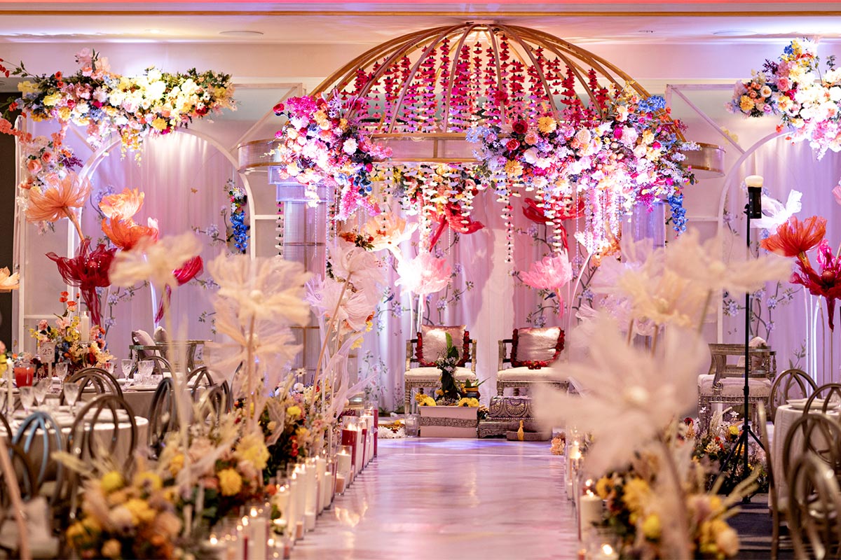Room setup and florals at large cultural wedding at Le Montage