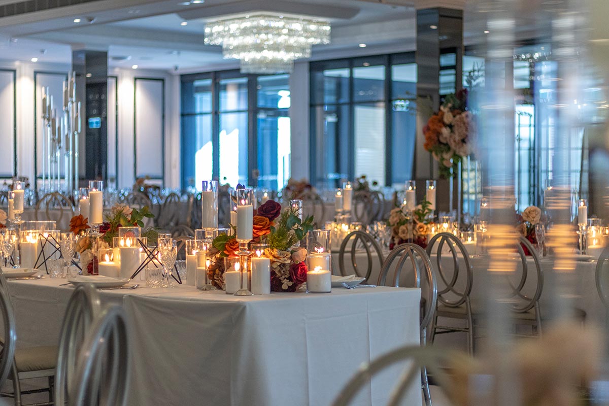 Room setup with candles at large cultural wedding at Le Montage