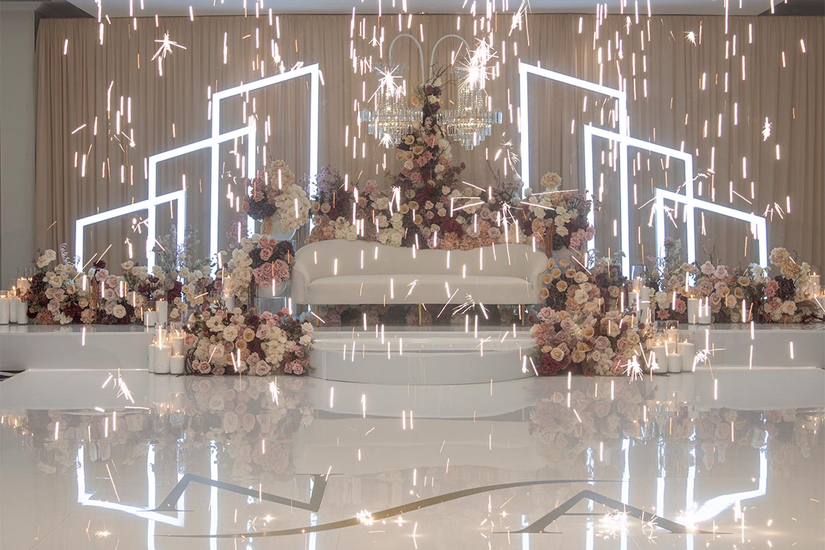Beautiful room setup at Le Montage with indoor fireworks and floral arrangement