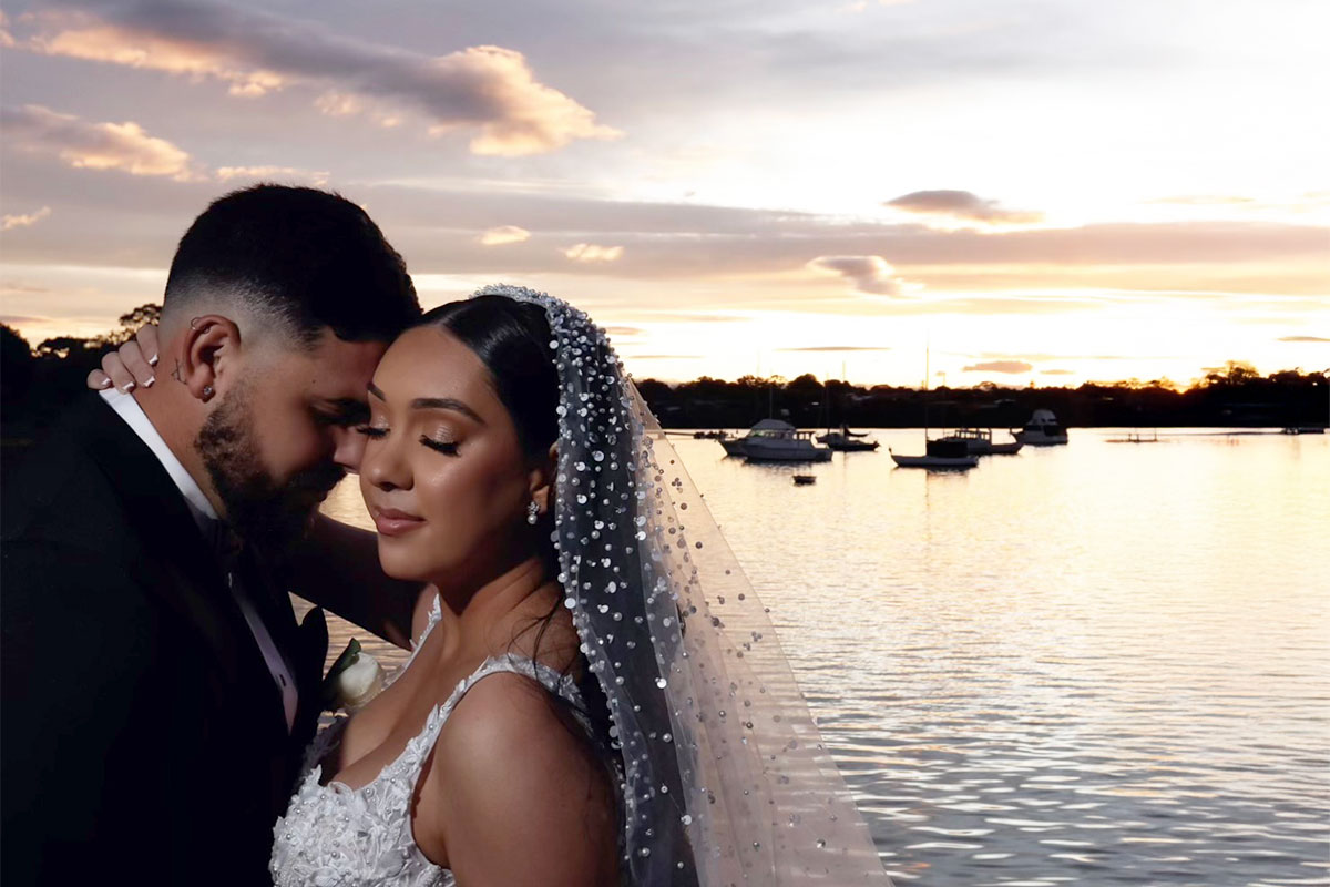 romantic image of bride and groom with sunset waterview at Le Montage