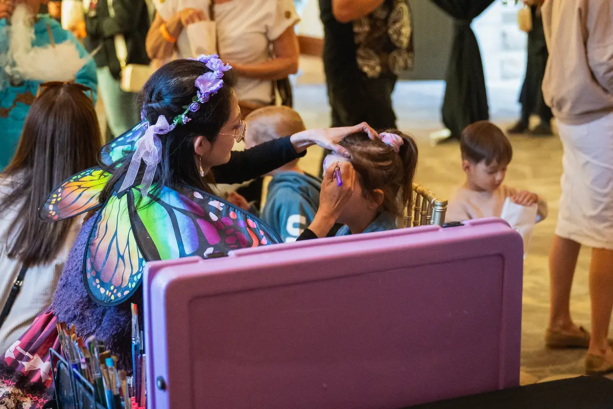 Children's entertainer face painting at a kids' party at Curzon Hall