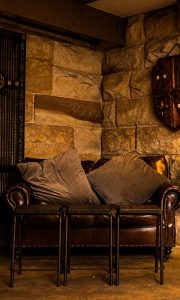 wine cellar couch and rustic table